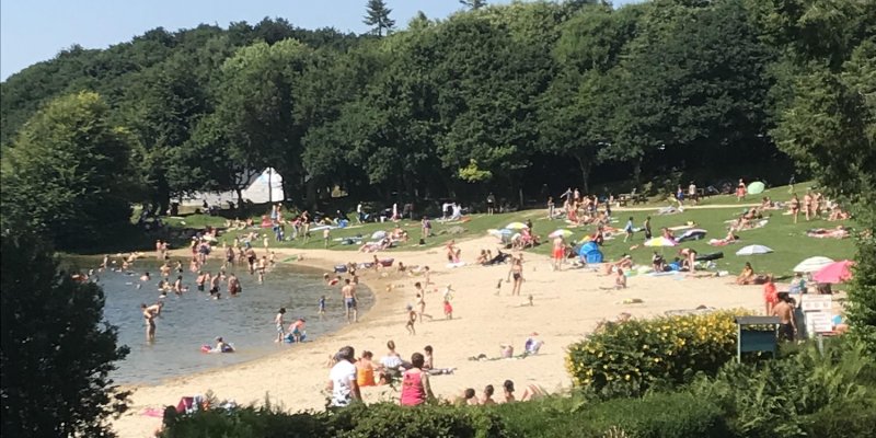 View of the lakeside beach full of people